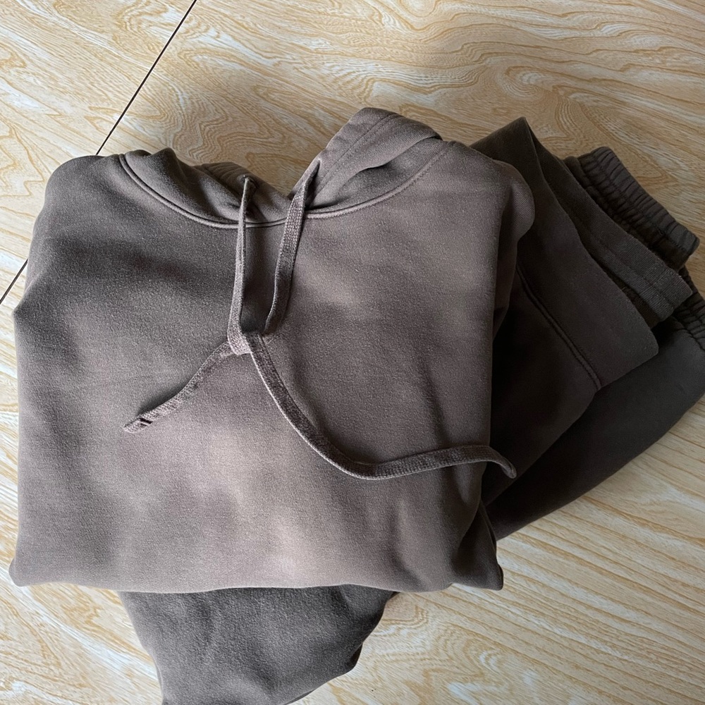 Girlfriend collective sweat pants and sweat shirt in fatigue green, size medium.